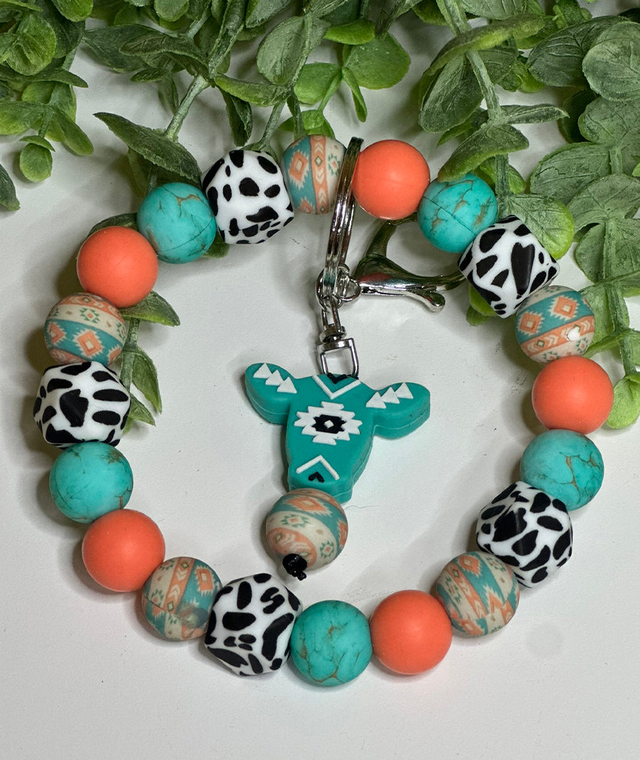 Coral & Mint Aztec Cow Wristlet