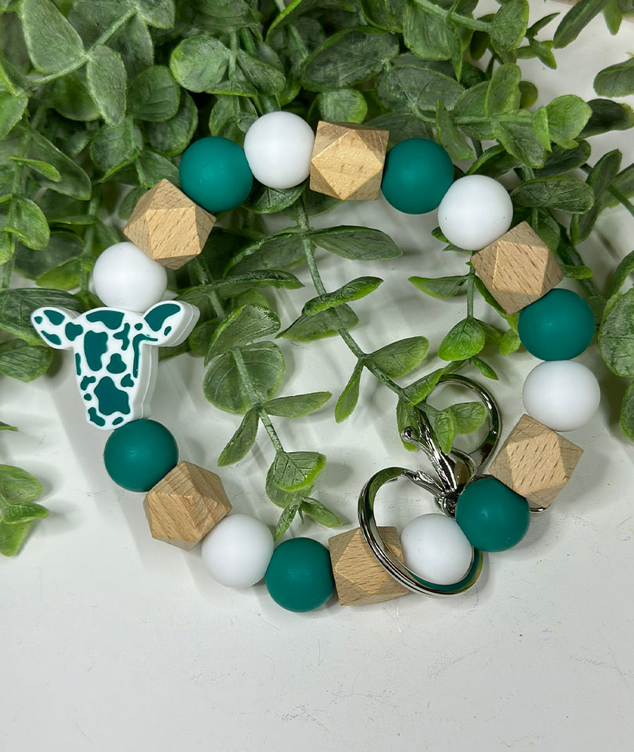 Deep Teal Ollie Cow Wristlet