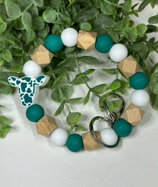 Deep Teal Ollie Cow Wristlet